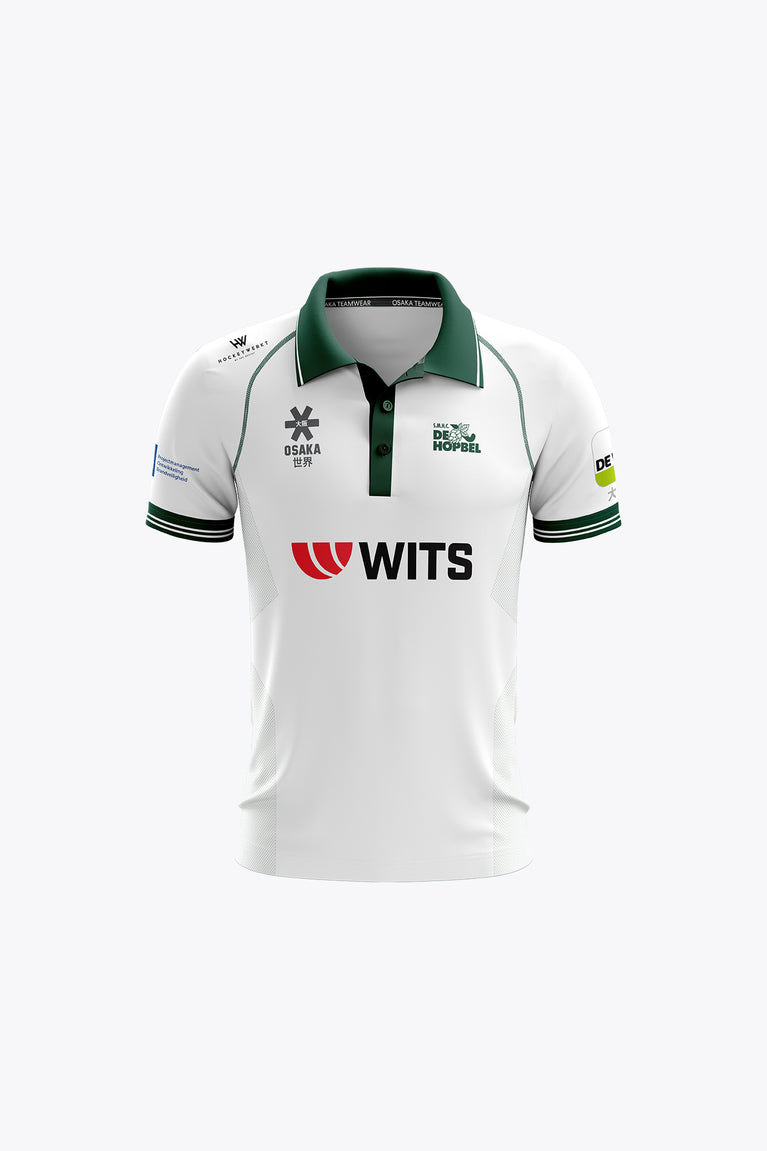 De Hopbel kids polo jersey in white with green collar, striped cuffs, and front logos.