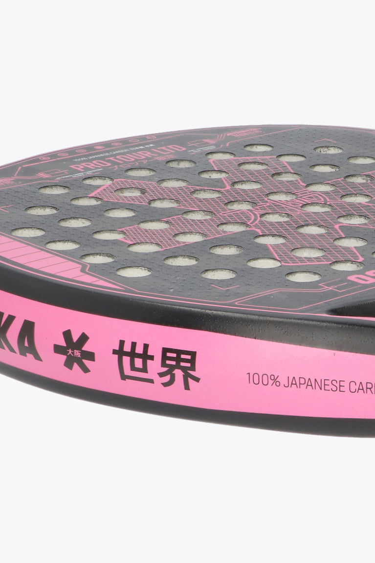 Black with pink accents Pro Tour LTD Padel Racket Tech, made with a technical teardrop shaped racket for high skill, smaller sweetspot for higher agility, precision and much more power, for a higher playability. Close-up left view