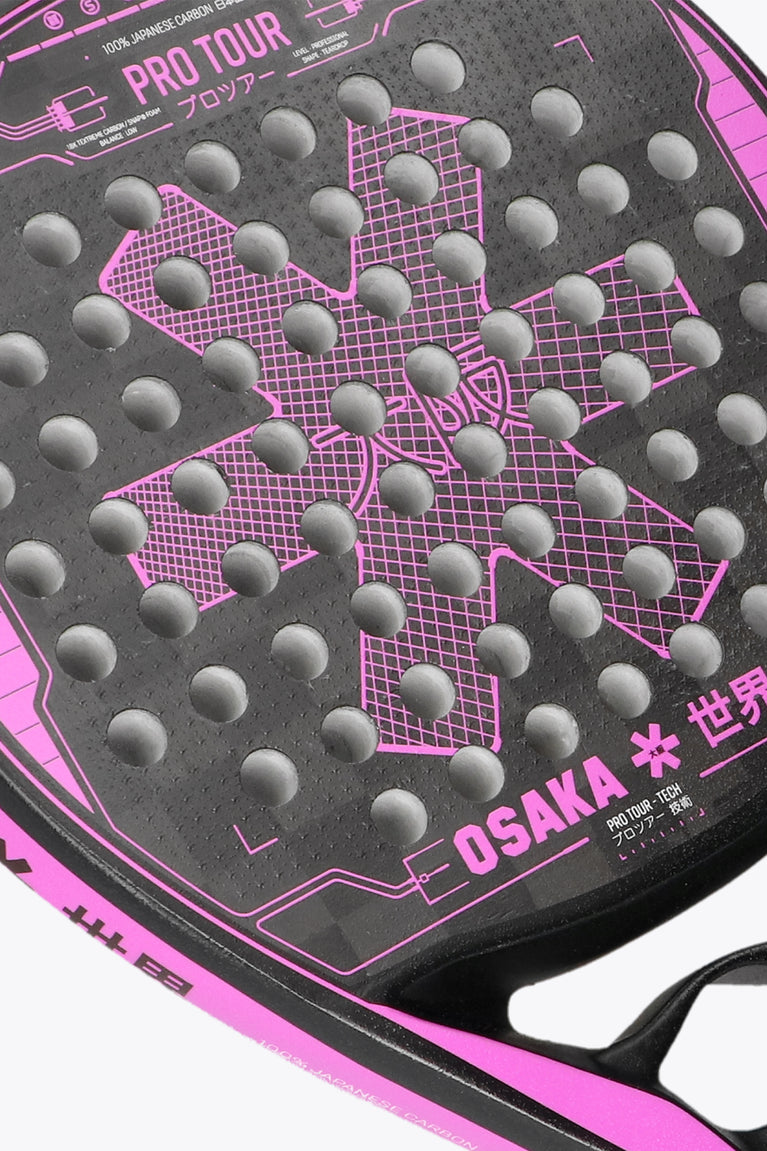 Black with Pink accents Pro tour padel racket tech technical teardrop shape for high skill, precision and agility for a power model. Reduced frame width for better playability, made with 18k Textreme Carbon. Close-up front view
