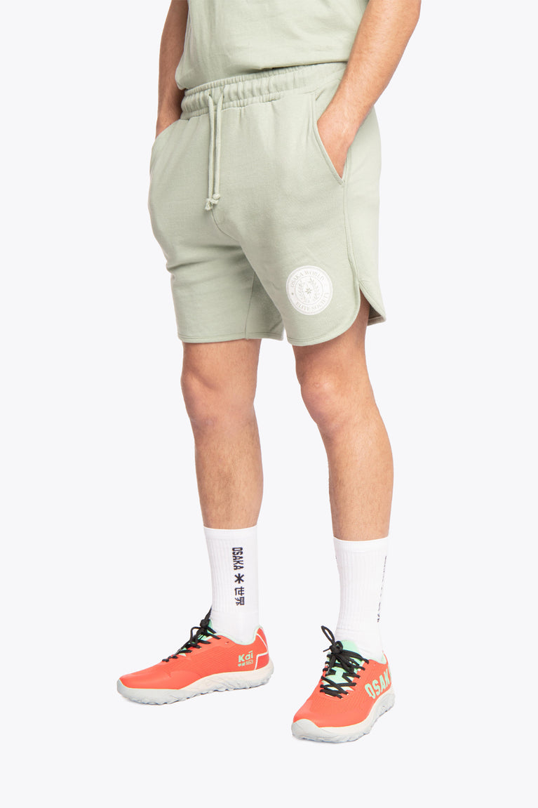 Iceberg green colour Osaka men shorts Elite Society from The Sports Society Collection made for a retro country vintage sport-chic aesthetics. 90s era ode style for that on-and off-field lifestyle. Photo of front-left view from waist and below of model view