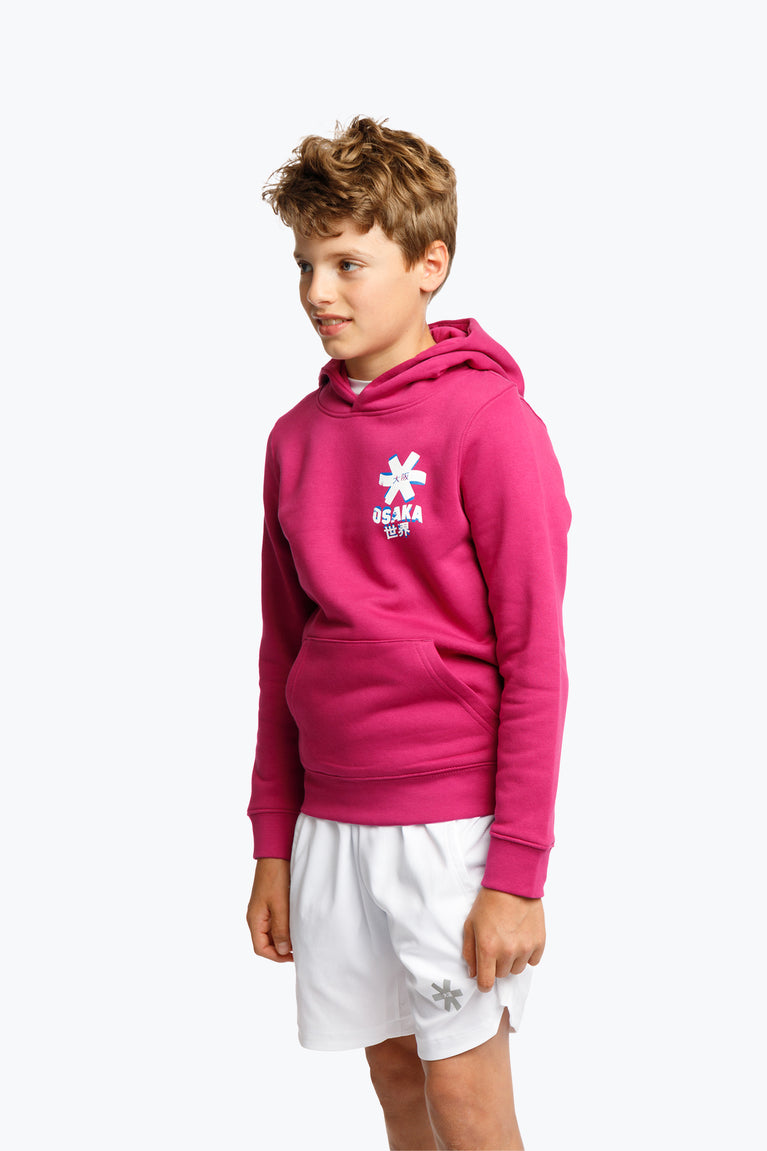 Orchid Pink Off-set star Hoodie for everyday use with kangaroo style pouch . Cotton mix with traditional details. Osaka logo in a fun print. Photo boy left-front