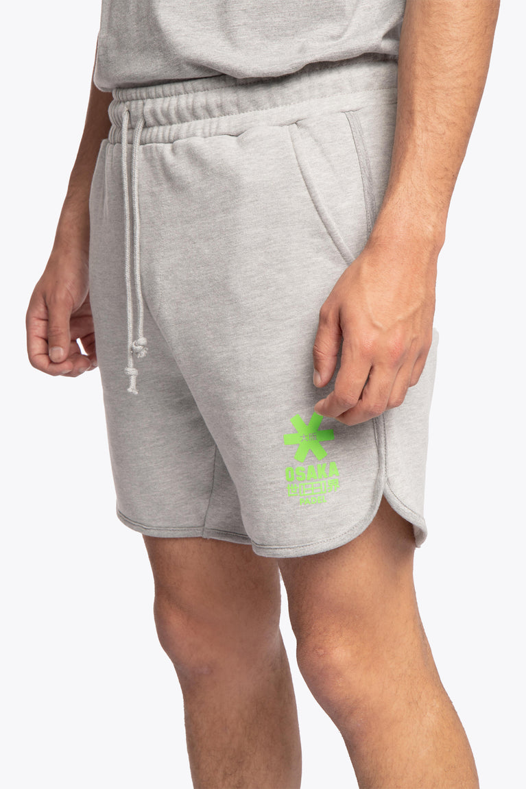 Grey Osaka Men shorts from the Padel Classic collection. Made for to be a timeless wardrobe classic for on-and off-field. Photo of close-up left front view of model